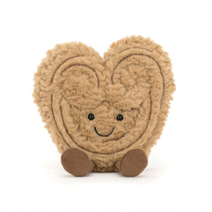 Front view of a Jellycat light brown heart-shaped palmier plush toy with a smiling face on a white background