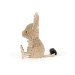 Side view of a Jellycat brown jerboa shaped plush on a white background. 