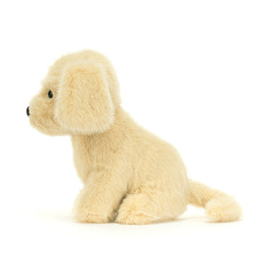 Side view of a Jellycat golden coloured puppy plush with a black nose on a white background. 