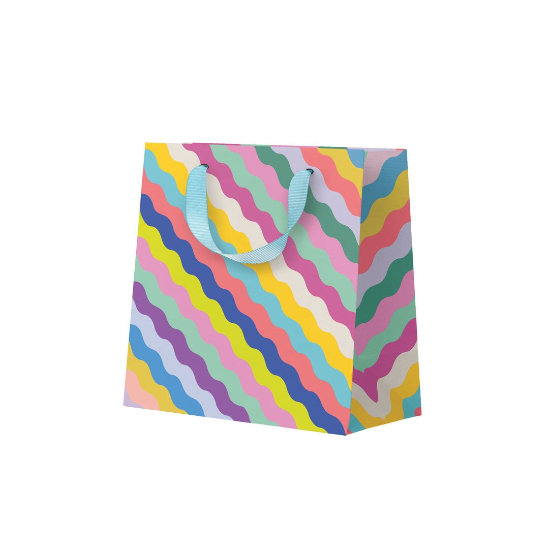 Mini paper gift bag with colourful wavy patterns on a white background.