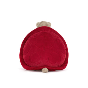 Back view of a beige Jellycat turtle plush a red shell with heart shaped stitching on a white background