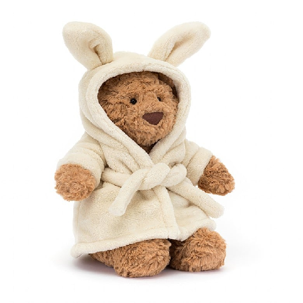 adorably soft plushie of a bear with a bunny bathrobe by popular brand Jellycat.