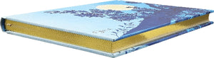Decorative hardback notebook with stylised moon and tree design and gold gilded page edges.