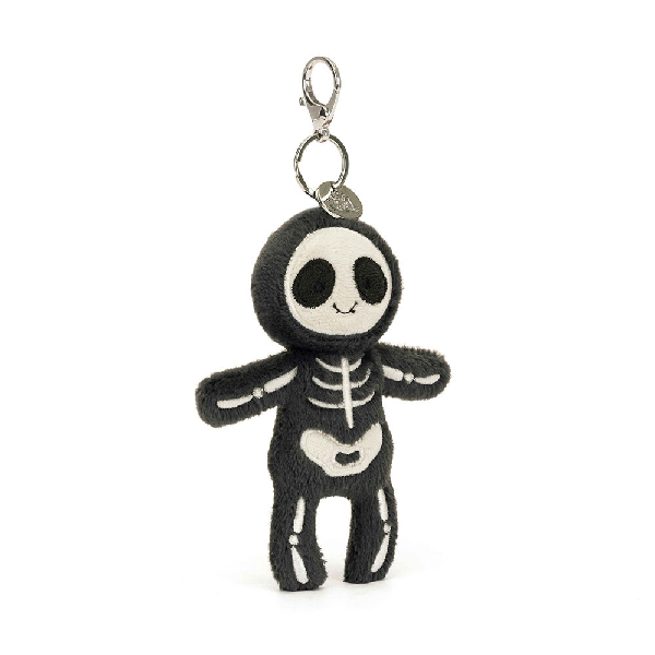 adorably soft bag charm of a smiling skeleton by popular brand Jellycat.