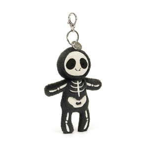 adorably soft bag charm of a smiling skeleton by popular brand Jellycat.