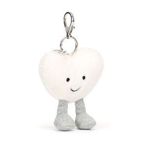 adorably soft bag charm of a smiling white heart by popular brand Jellycat.