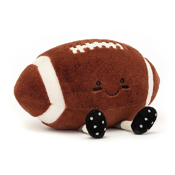 adorably soft plushie of a smiling football with cleats by popular brand Jellycat.