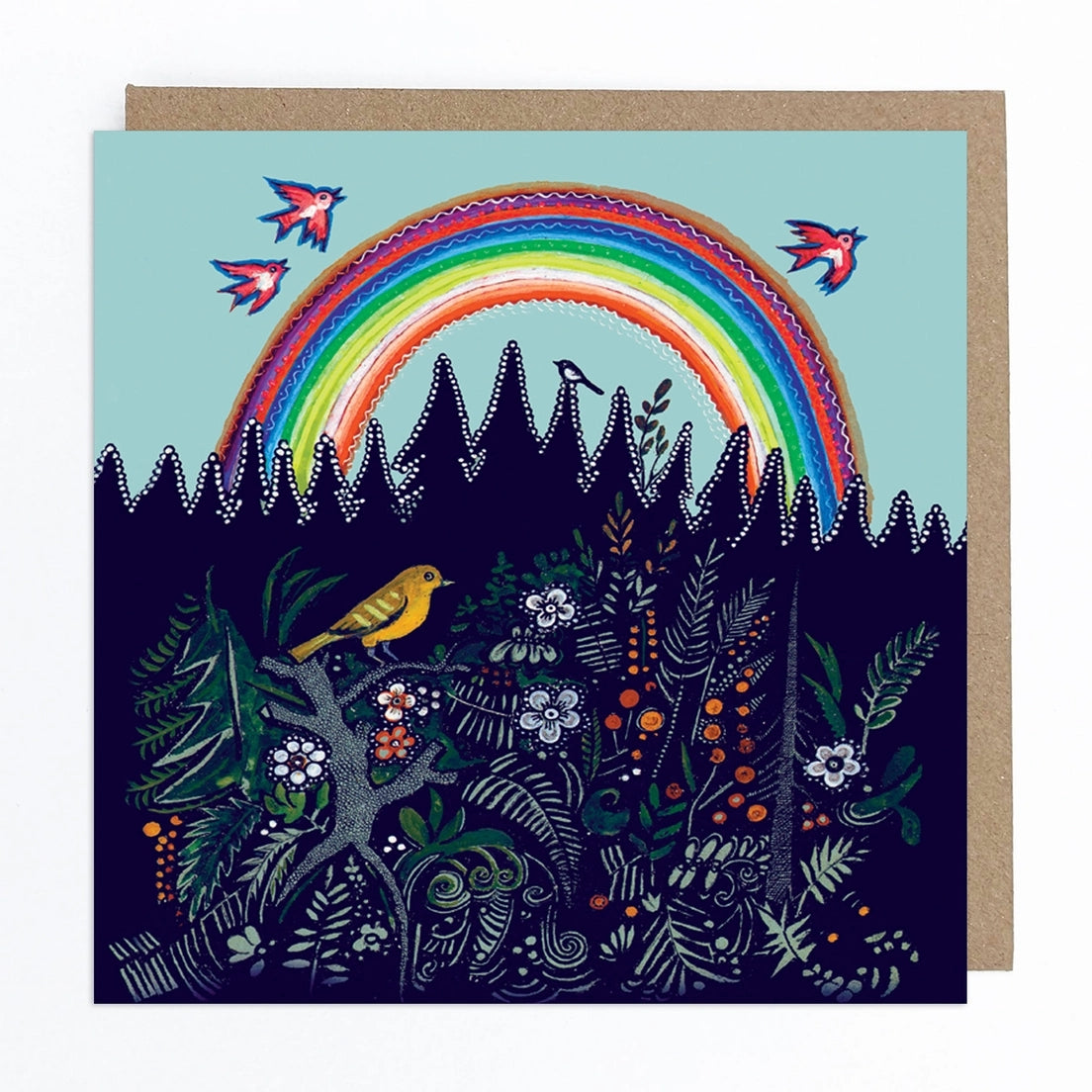 Greeting card featuring a folk art style illustration of a yellow bird perched on top of a bush with flowers and berries. In the background, a big rainbow sits behind a forest, against a blue sky. Three red birds fly over the rainbow, while another black and white one perches on top of a tree.