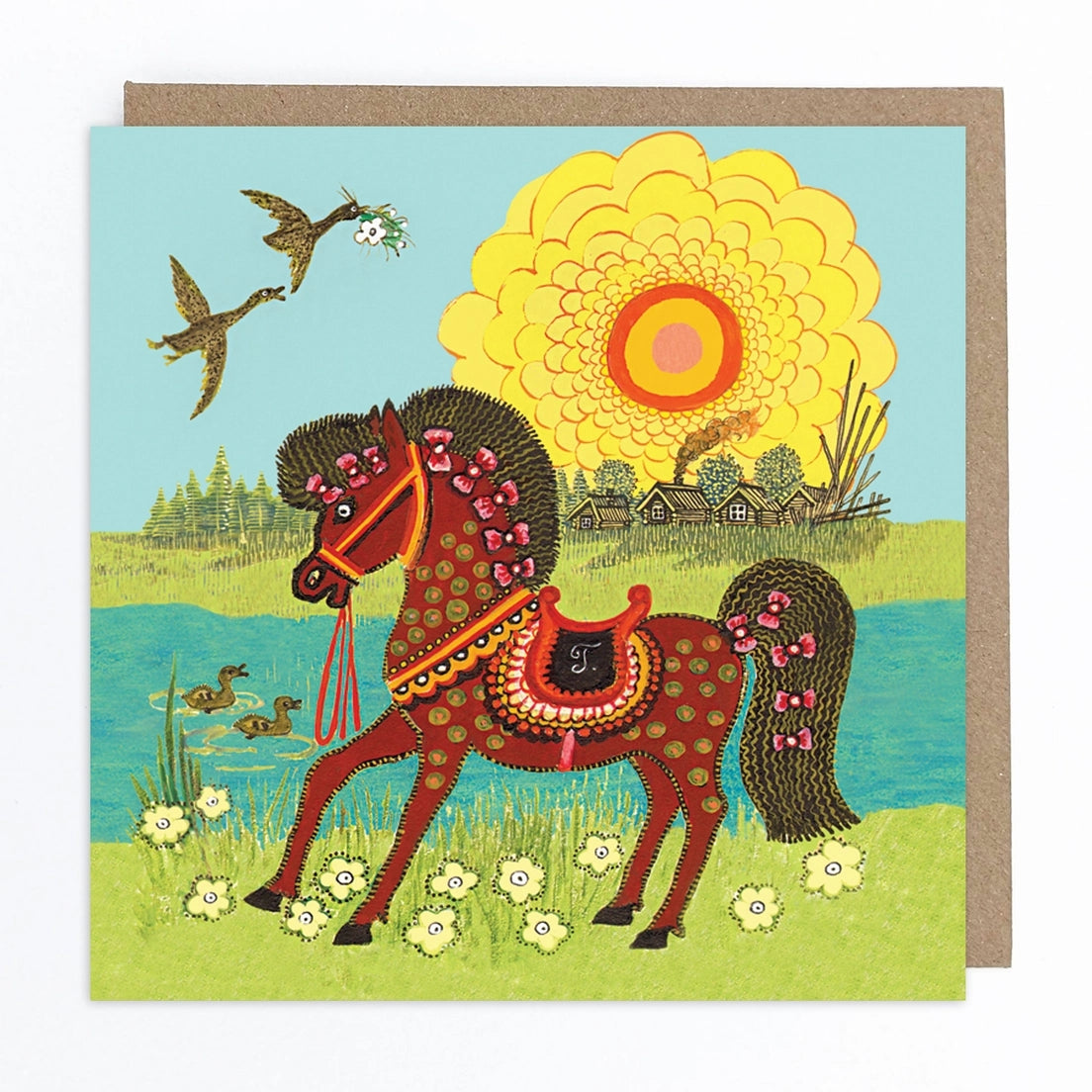 Card featuring a folk art style illustration of a brown horse with pink bows in it's mane and tail. The horse stands on some grass with flowers in front of a lake, as some ducks swim by. In the background, the sun shines brightly behind some wooden houses and trees. Two birds are flying in the sky over the lake, one of which is carrying a flower in it's beak. 