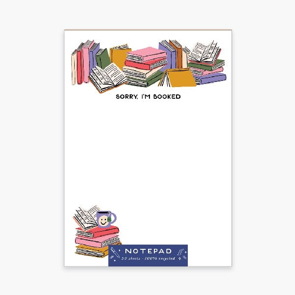 blank notepad with piles of books illustrated on the top and on the left bottom corner. top text reads "sorry i'm booked"