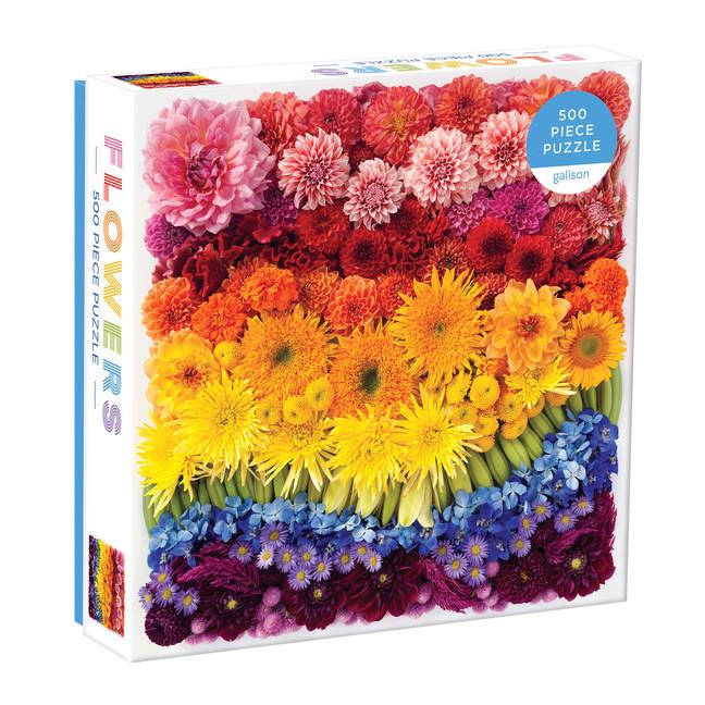 Puzzle box featuring images of different coloured flowers colour coordinated to create a rainbow effect along with the text 'Flowers' on the side of the box. 
