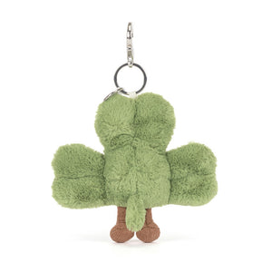 Back view of a Jellycat plush bag charm shaped like a green clover with a smiling face on a white background