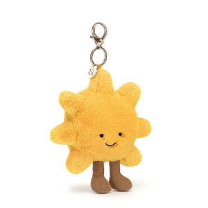 adorably soft bag charm of a smiling sun with legs by popular brand Jellycat.