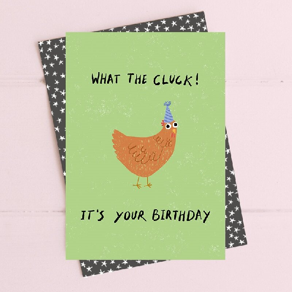 pale green birthday card with a silly chicken wearing a blue birthday card. top text reads "what the cluck!" bottom text reads "it's your birthday"
