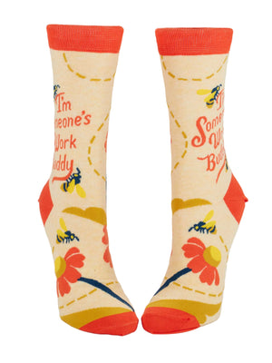 Colorful socks with text saying 'I'm someone's work buddy' showing images of wasps and floral designs on a white background