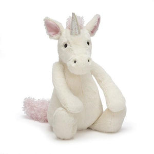 adorably soft plushie of a white unicorn with a silver horn by popular brand Jellycat.